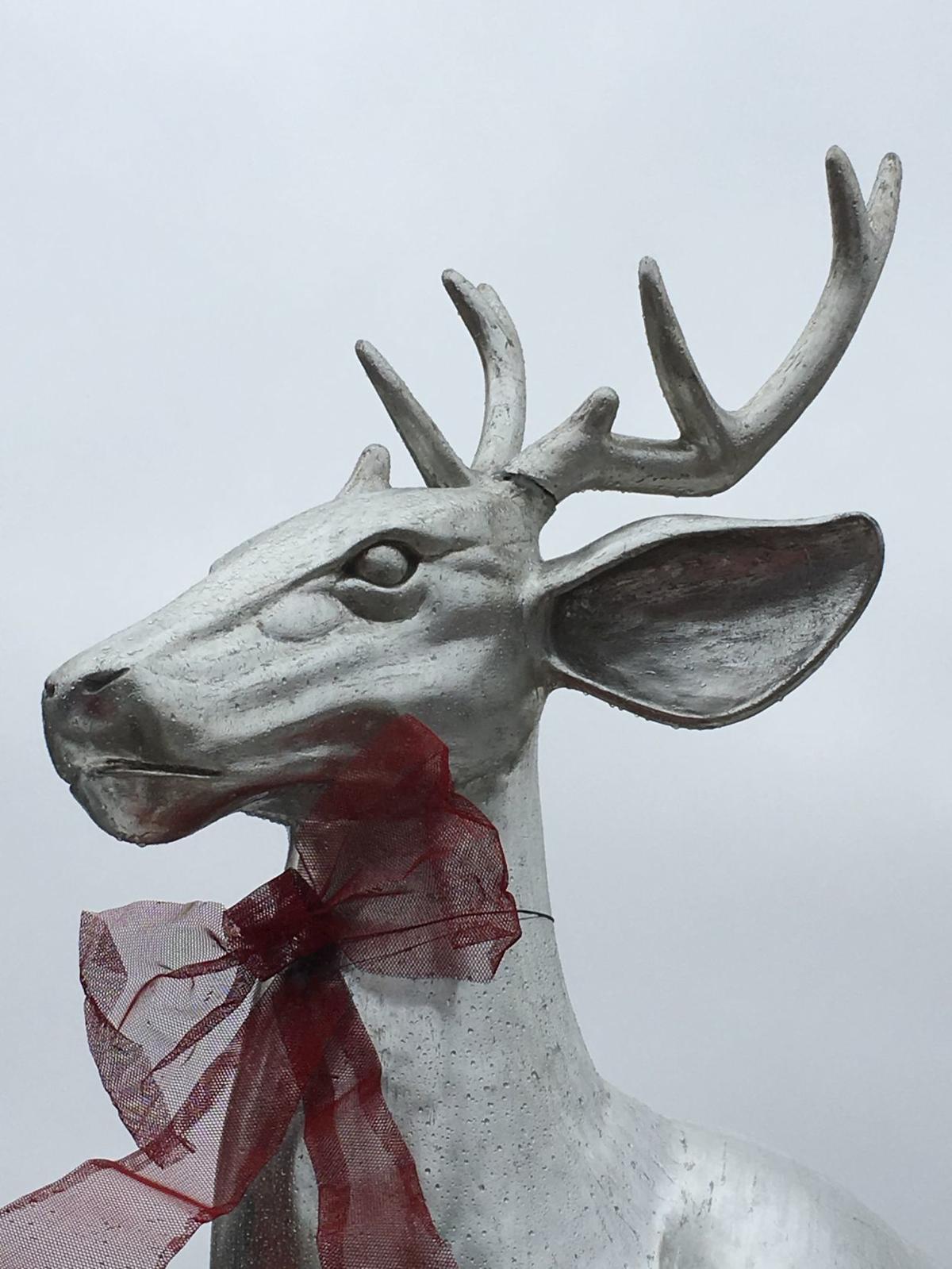 large silver reindeer statue