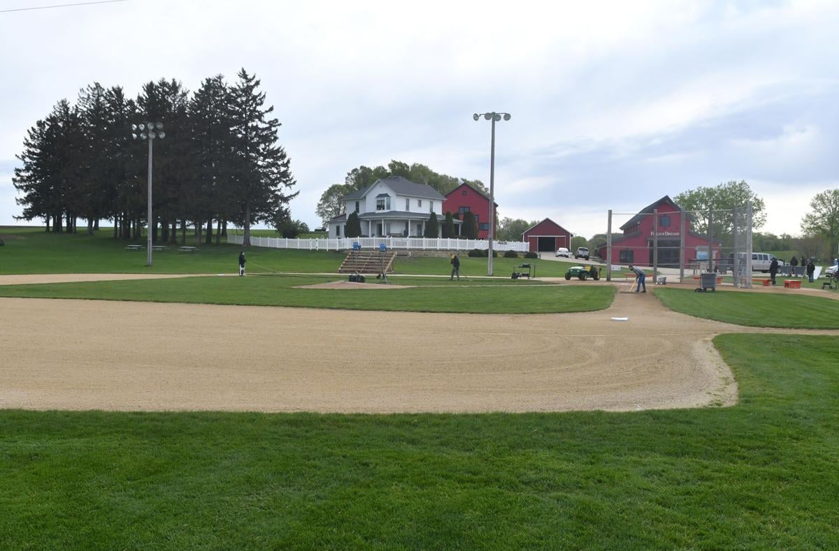 Ghost players run to their positions at the original Lansing Farm site in  Dyersville, Iowa, where the nostalgic movie Field of Dreams was filmed in  1989