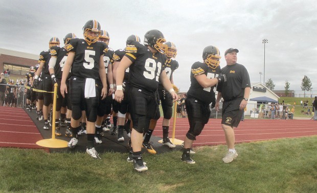 Bettendorf great Pat Angerer kicks off The Score with help from his former  head coach