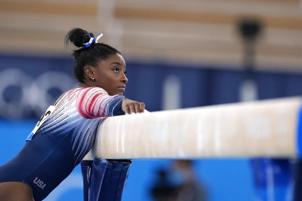 Snapshots from Simone Biles' balance beam routine