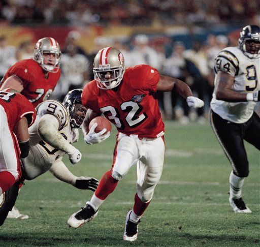 Tampa Bay Buccaneers' tight end Dave Moore (83) fumbles the ball during  second-quarter action as Seattle Seahawks' linebacker Leroy Hill (56) and  safety Michael Boulware (28) tackle him at Raymond James Stadium