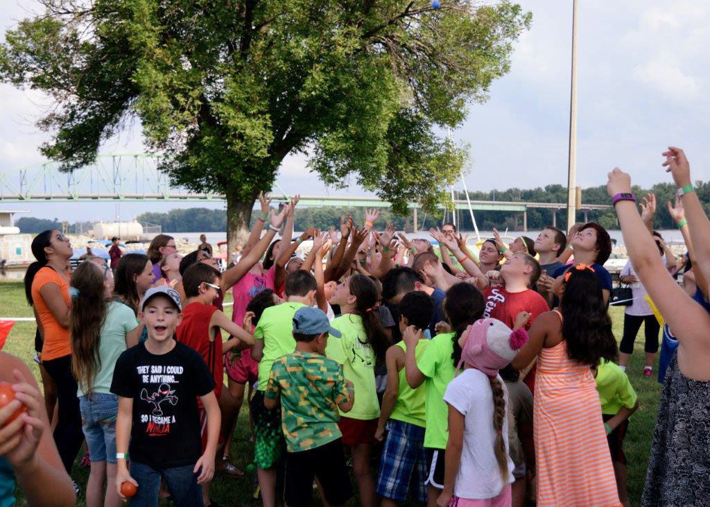 Kids Try To Catch Ping Pong Balls During Great River Days Local