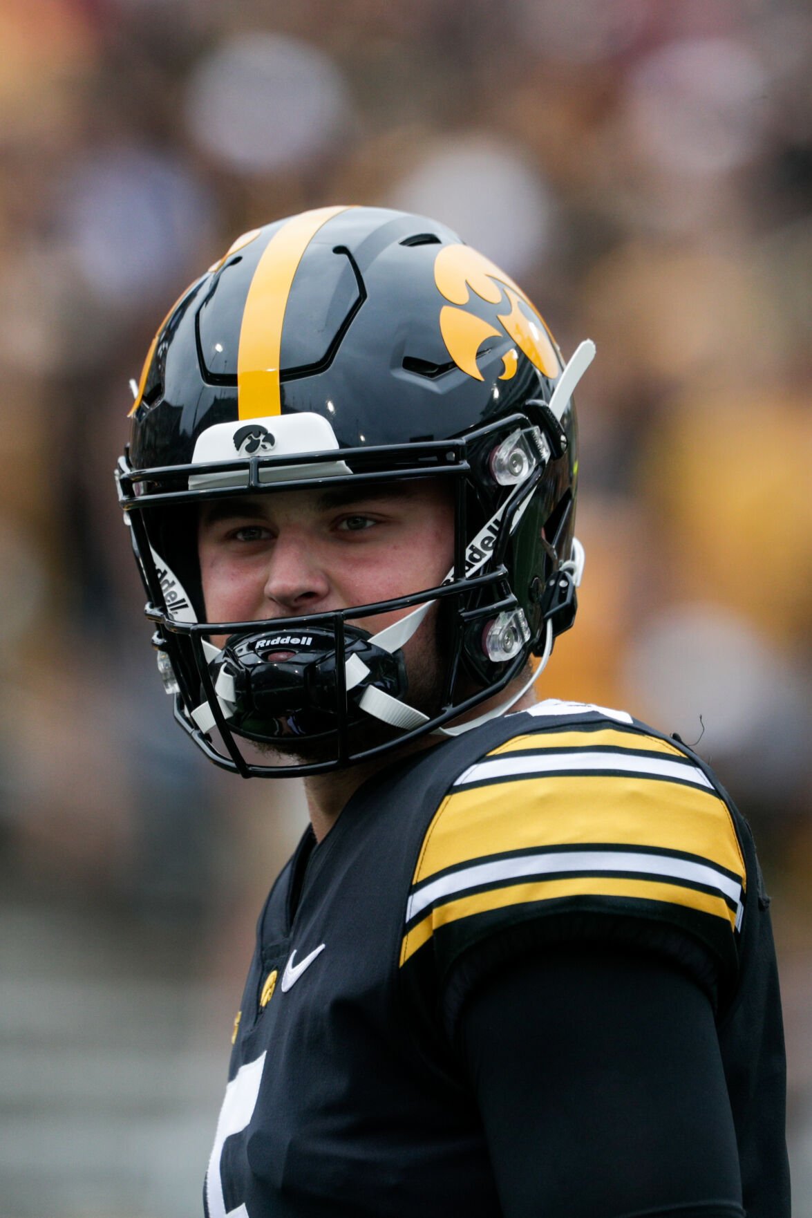 ISU's Brock Purdy wears Iowa Hawkeyes headgear after Cy-Hawk game