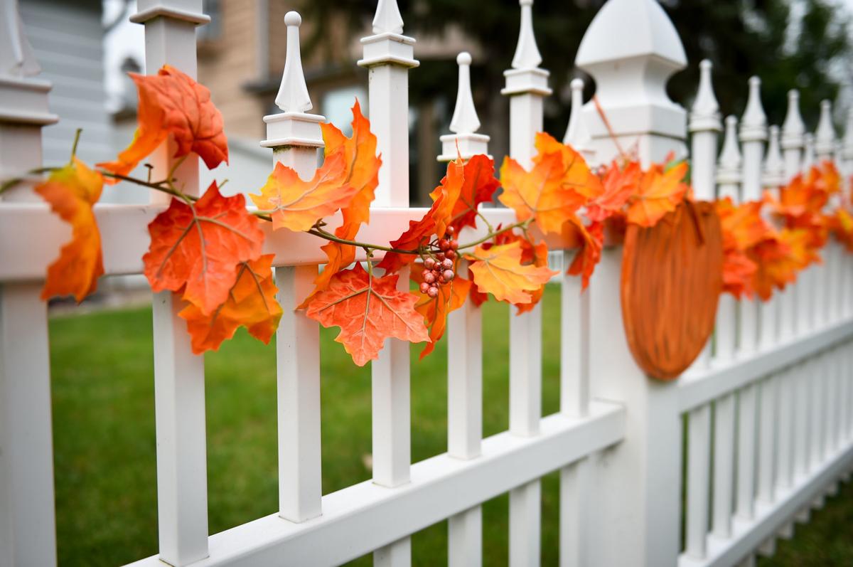 Couple Bought House So They Could Decorate Its Fence Home