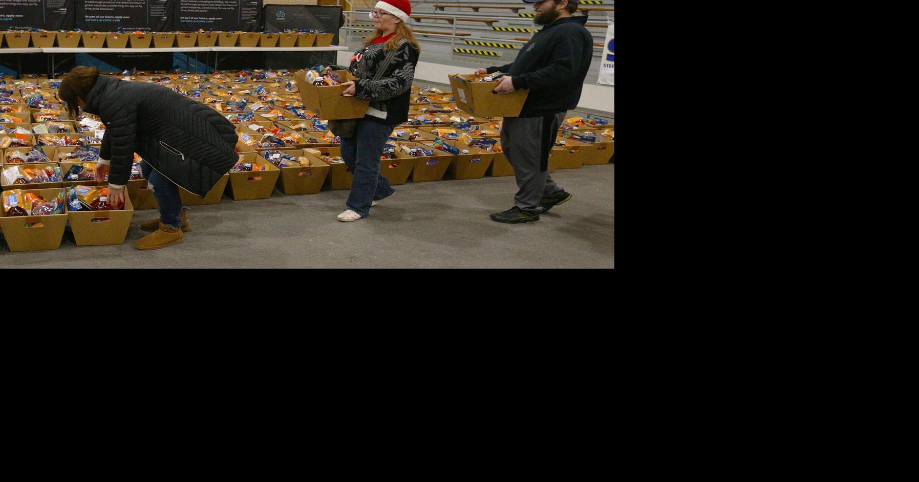 Arconic employees pack food boxes for Quad-Cities families