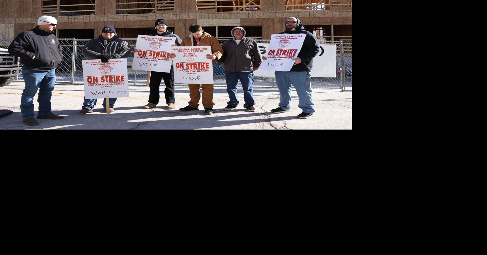 Why a local carpentry union is picketing a downtown apartment building construction