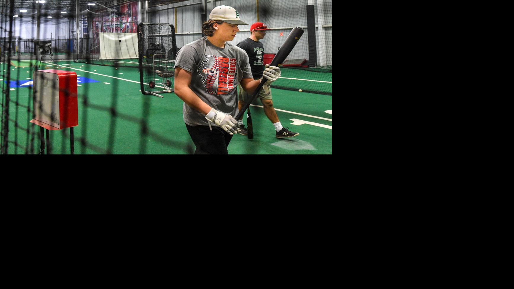 Photos High School baseball players practice batting at Fielder's