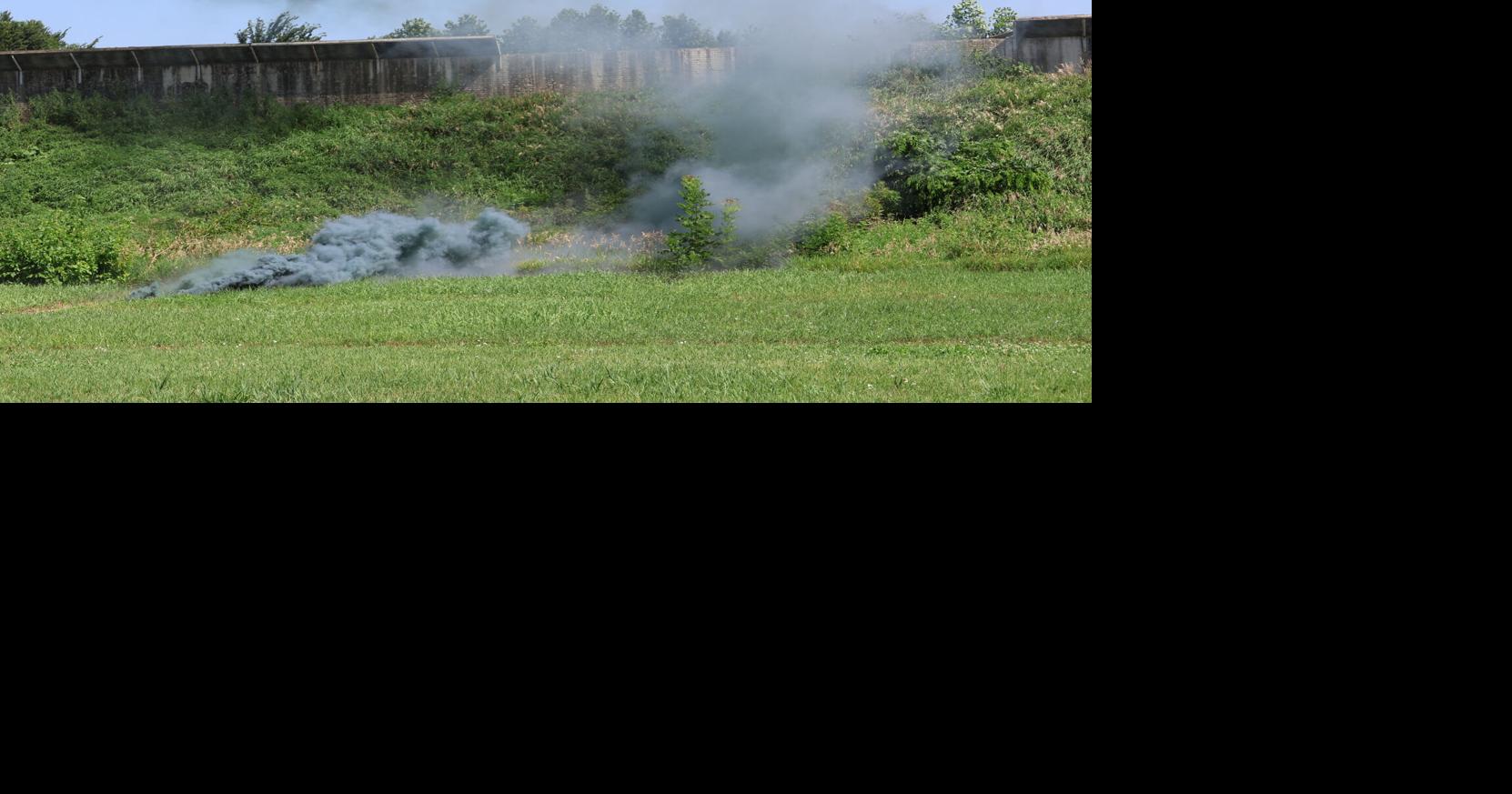Scott County deputy demonstrates using a smoke bomb