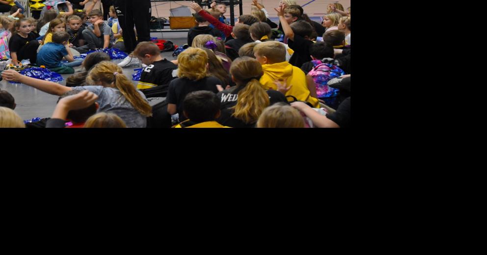 IOWA WOMEN'S BASKETBALL Martin stars in visit to Blue Grass Elementary