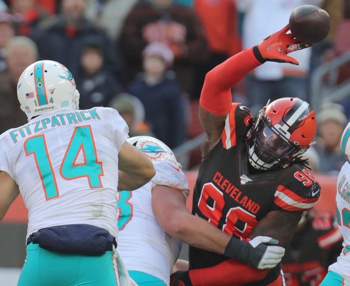 Cleveland Browns' Sheldon Richardson swats away a third quarter pass by Miami Dolphins quarterback Ryan Fitzpatrick on Sunday, Nov. 24, 2019 in Cleveland, Ohio, at FirstEnergy Stadium. The Browns won the game 41-24.