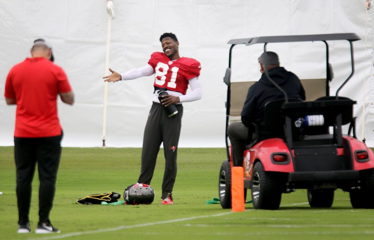 Bucs wide receiver Antonio Brown talks with staff as coach Bruce Arians arrives for a chat during a November practice at AdventHealth Training Center in Tampa.
