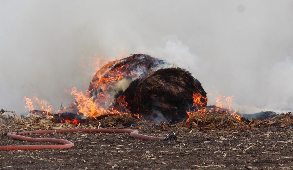 Firefighters battle large hay bale fire in Blue Grass Local News