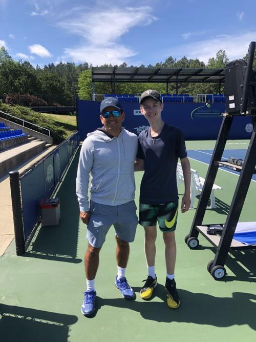 Nicholas Patrick (right) and tennis coach Nestor Nunez
