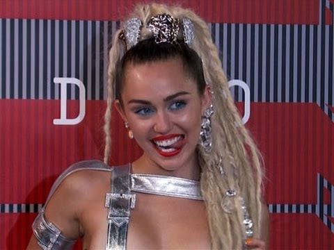 Boob Tit Miley Cyrus - Kanye rants, Miley Cyrus flashes breast at MTV awards show