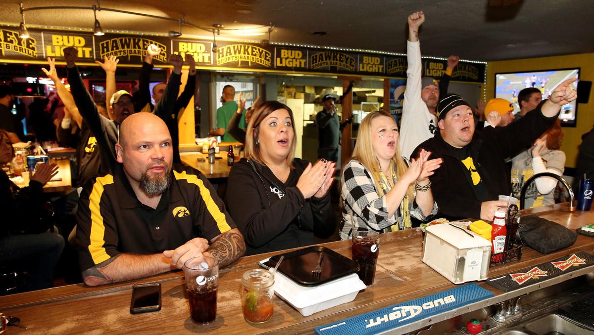 Hawk fans find good food, friends in Davenport for the Outback Bowl Local News