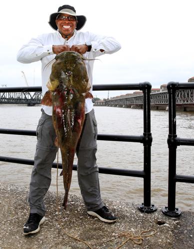 It took a team effort to land this giant catfish