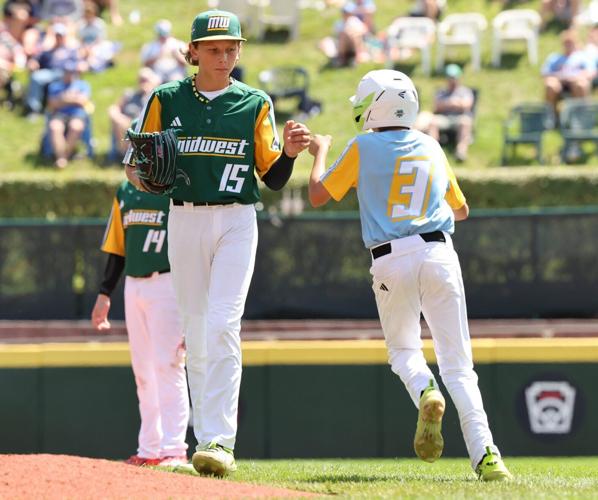 Pitcher Cooper Thissen of Davenport, Iowa, (Midwest Region)  is congratulated by Asher Giglio of Bonita, California (West