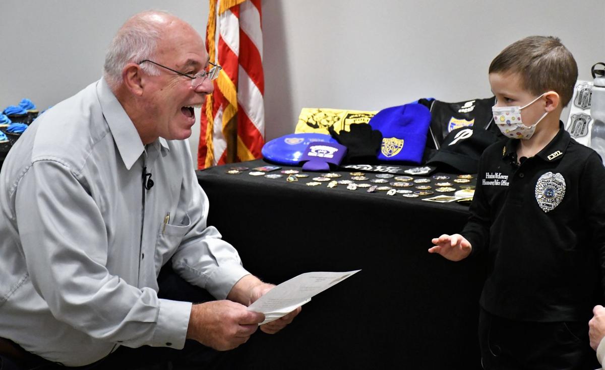 Eldridge boy recovering from leukemia sworn in as honorary police officer | Local Crime & Courts 111221-qc-nws-hudson-018.JPG