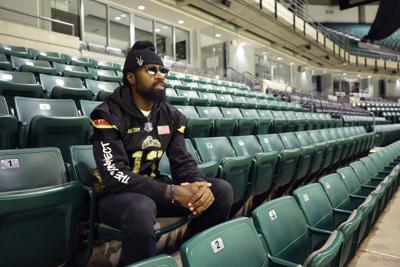 Full steam ahead: Quad City Steamwheelers' Keyvan Rudd leads on the turf, in the community