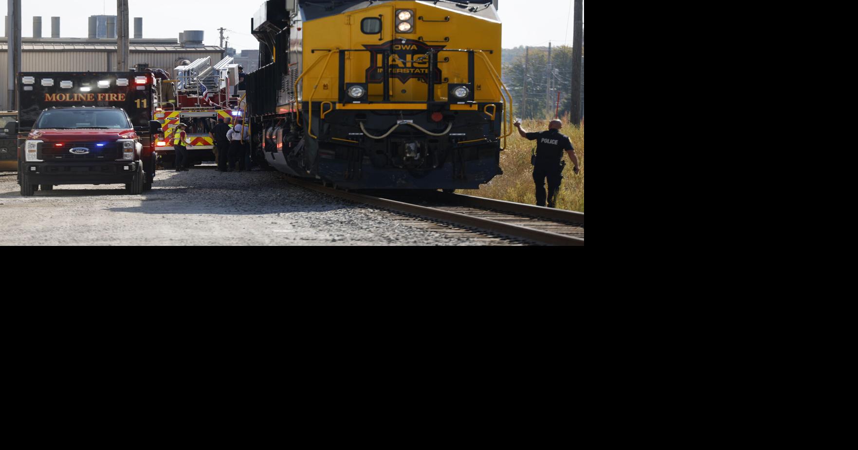 Train hits fire-dept ladder truck strut during fire in Moline early 09/11