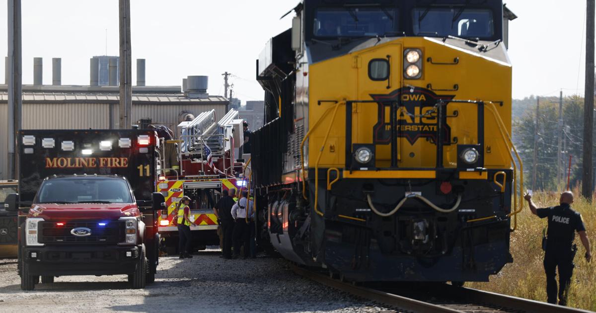 Train hits fire-dept ladder truck strut during fire in Moline early 09/11