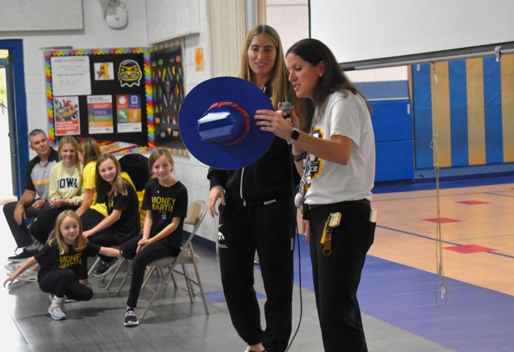 IOWA WOMEN'S BASKETBALL Martin stars in visit to Blue Grass Elementary