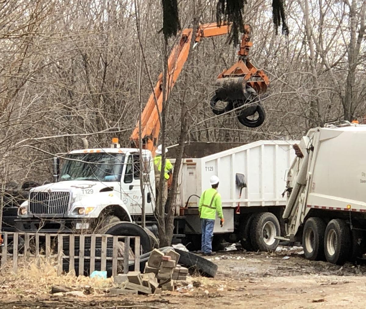 City crews remove hundreds of tires from Davenport yard