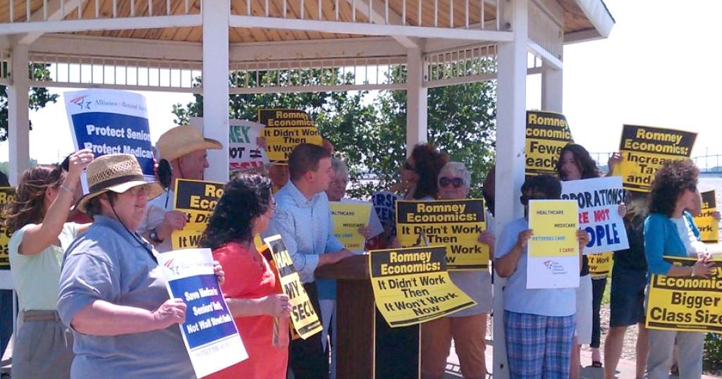 Progressives rally against Romney