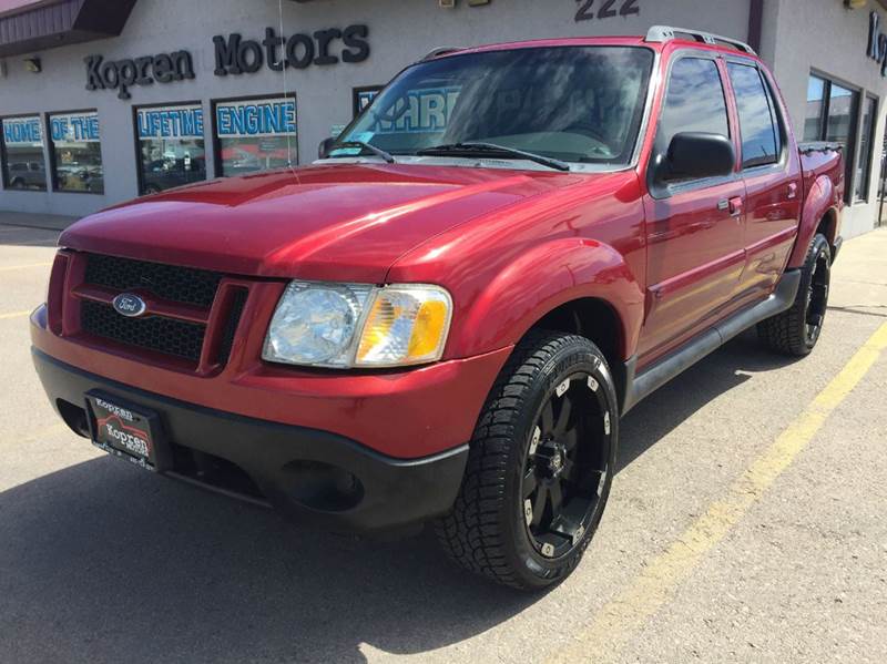 2004 Red Ford Explorer Sport Trac Trucks