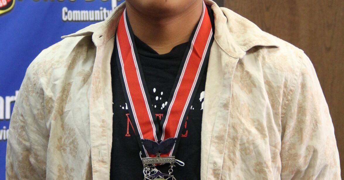 Cody Two Bulls wearing medal