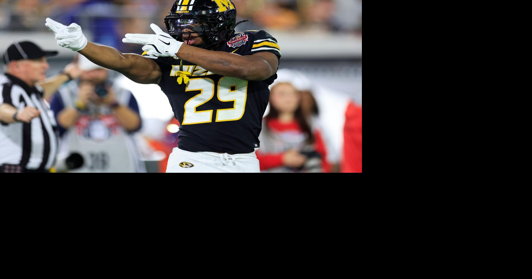 Missouri Tigers running back Ahmad Hardy (29) reacts to his first down pickup during the first quarter of the TaxSlayer Gator