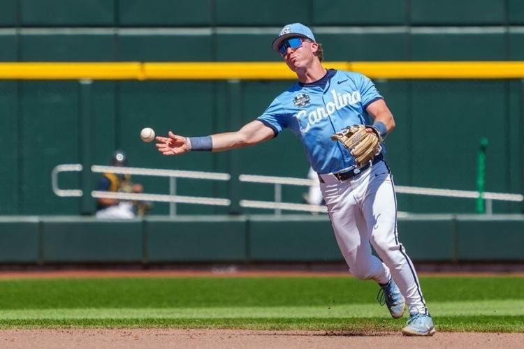 Jun 17, 2026; Omaha, NE, USA; North Carolina Tar Heels third baseman Cooper Nicholson (1) throws to first against the West Virginia Mountaineers during the seventh inning at Charles Schwab Field. Mandatory Credit: Dylan Widger-Imagn Images