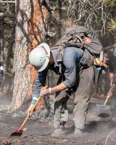 Photo of firefighter working on a wildfire.
