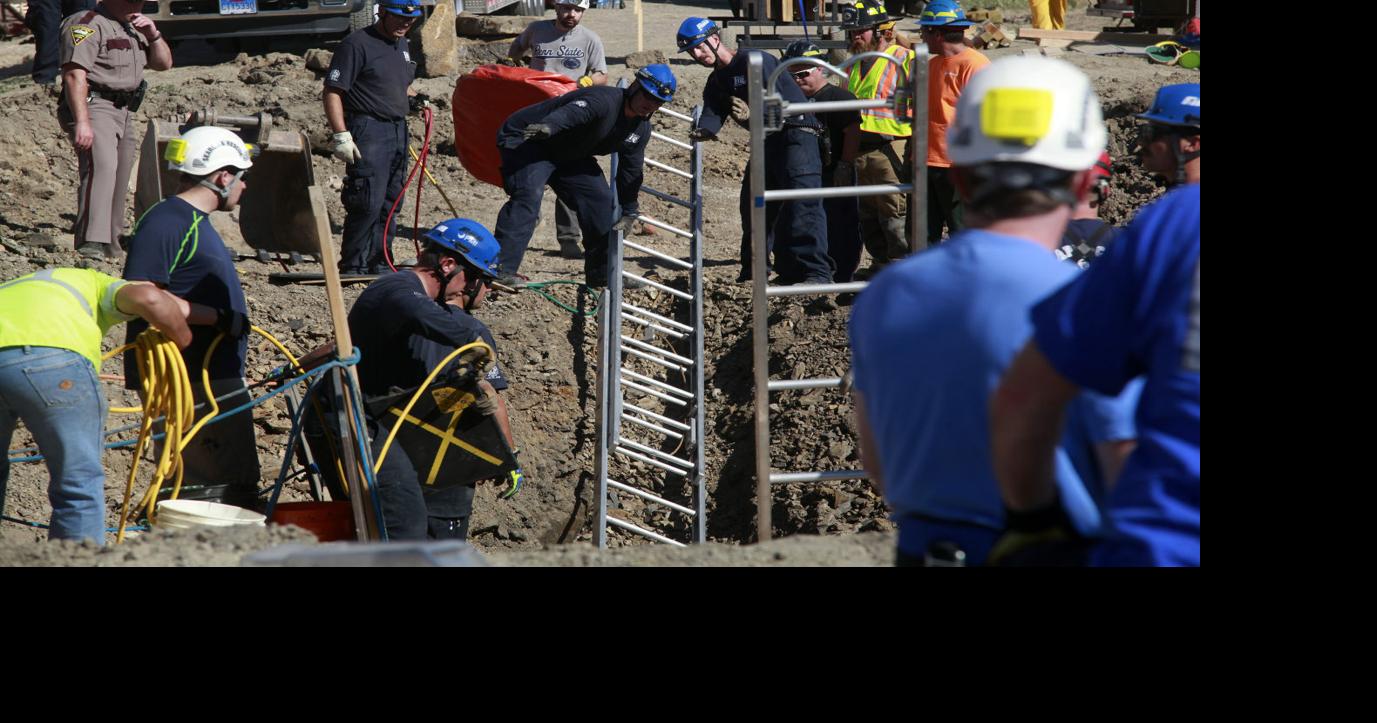 Two workers rescued from collapsed trench