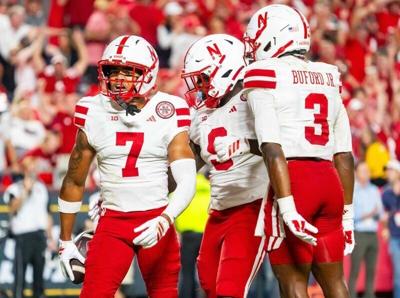 Aug 28, 2025; Kansas City, Missouri, USA; Nebraska Cornhuskers defensive back Malcolm Hartzog Jr. (7) celebrates with linebacker Vincent Shavers Jr. (9) and defensive back Marques Buford Jr. (3) after an interception against the Cincinnati Bearcats duri...