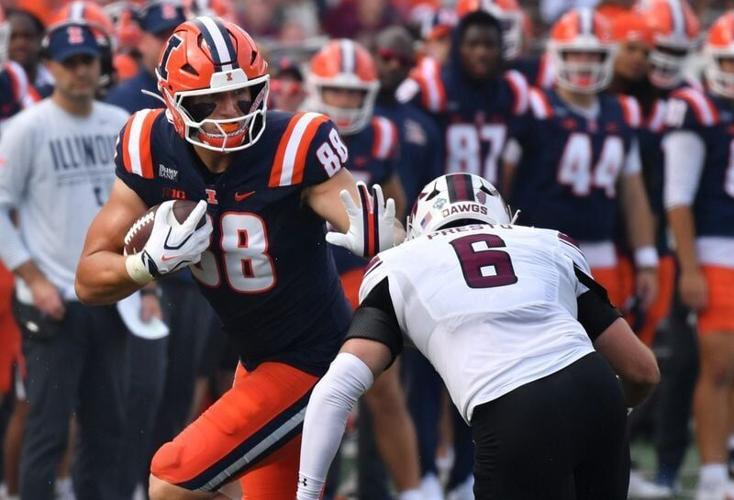 Sep 19, 2026; Champaign, Illinois, USA;  Illinois Fighting Illini tight end Davin Stoffel (88) stiff arms Southern Illinois Salukis linebacker Chris Presto (6) eduring the second half  at Gies Memorial Stadium.  Mandatory Credit: Ron Johnson-Imagn Images