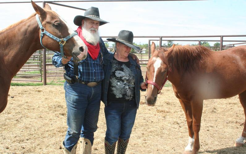 Dan and Grace Boyd tend to their horses