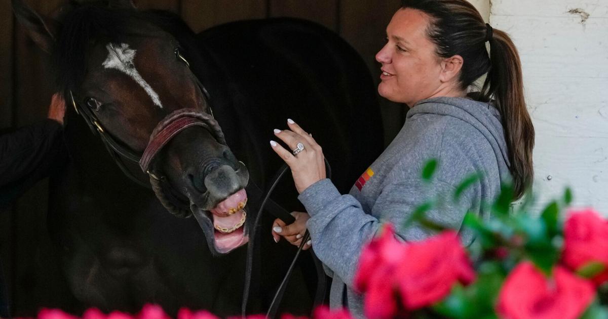 Golden Tempo reached to nip the lead as Cherie DeVaux takes him out of his stall after winning the 152nd running of the Kentucky