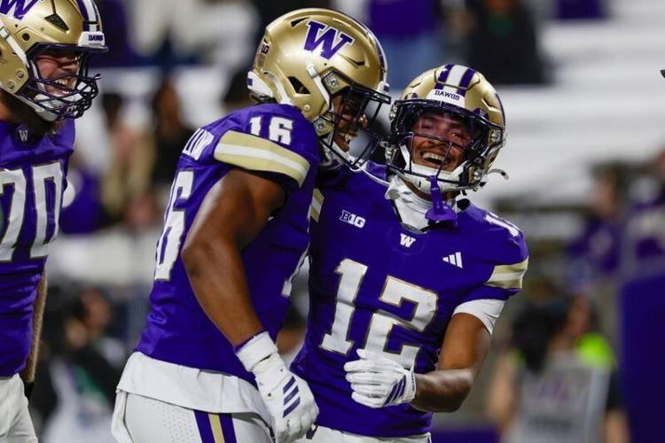 Sep 19, 2026; Seattle, Washington, USA; Washington Huskies wide receiver Trez Davis (12) celebrates with wide receiver Justice Williams (16) and offensive lineman Justin Hylkema (70) after rushing for a touchdown against the Eastern Washington Eagles du...