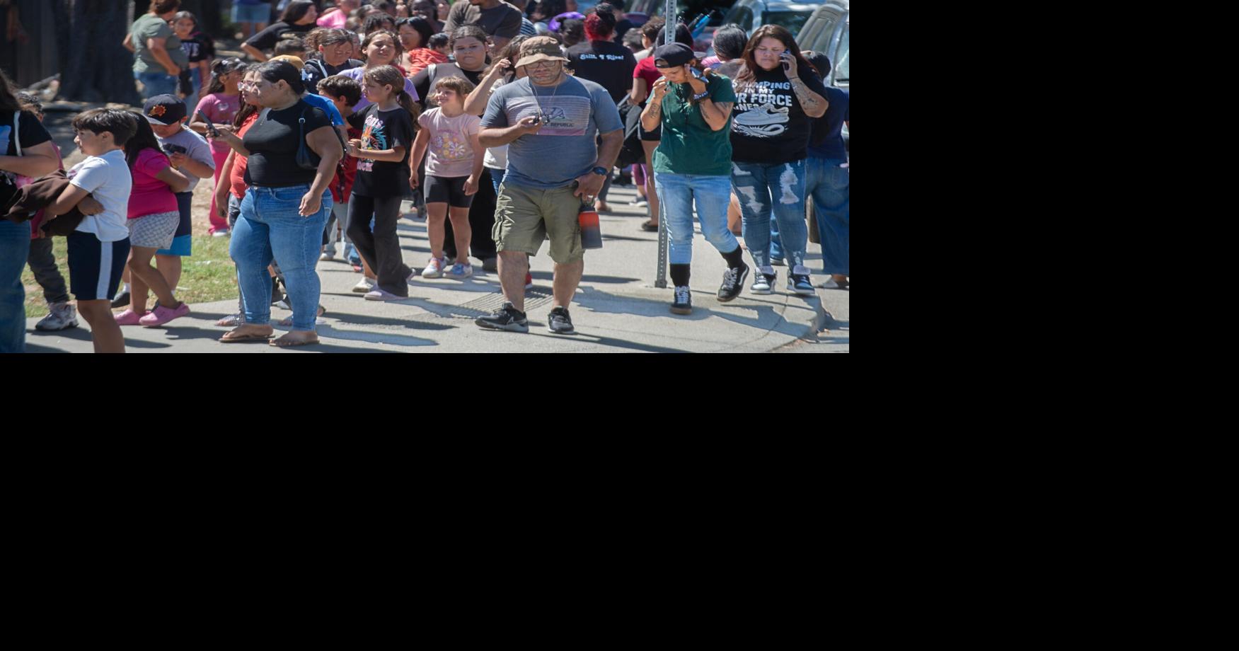 Families line up along S. Van Buren Street at Weber Avenue to get a free backpack at the Stockton Unified School District’s 4th annual backpack giveaway at the Weber Institute of Applied Sciences and Technology in downtown Stockton on Jul. 28, 2026.