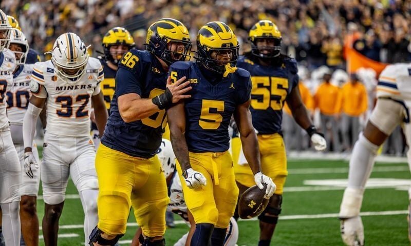 Michigan celebrates Savion Hiter's second touchdown.