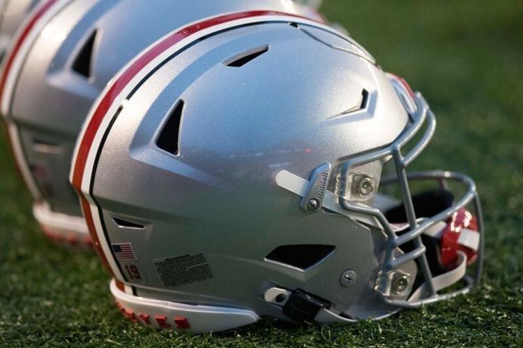 Oct 28, 2023; Madison, Wisconsin, USA; Ohio State Buckeyes helmets sit on the field during warmups prior to the game against the Wisconsin Badgers at Camp Randall Stadium.