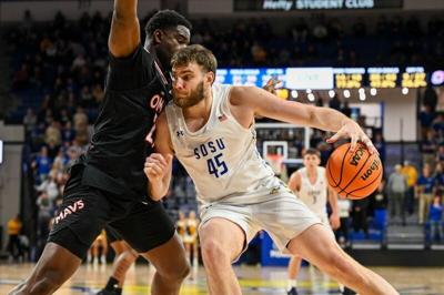 South Dakota State Jackrabbits center Oscar Cluff (45) posts up against Omaha Mavericks forward Valentino Simon (21) on Thursday, Feb. 13, 2025, at First Bank and Trust Arena in Brookings, S.D.