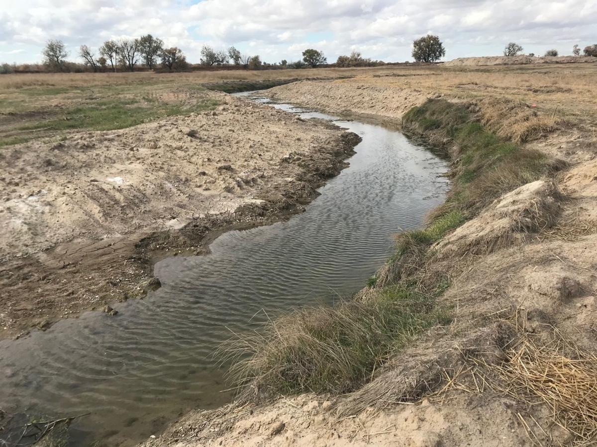 Group building trout stream in Nebraska Panhandle