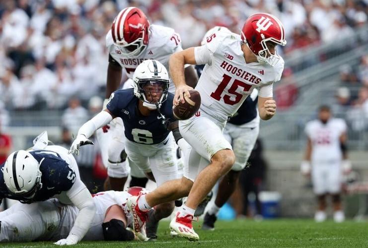 Nov 8, 2025; University Park, Pennsylvania, USA; Indiana Hoosiers quarterback Fernando Mendoza (15) runs with the ball while being pressured by Penn State Nittany Lions safety Zakee Wheatley (6) during the third quarter at Beaver Stadium. Mandatory Cred...