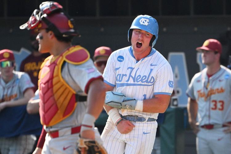 North Carolina infielder Cooper Nicholson (1) celebrates after scoring a run against Southern California during the ninth inning of their NCAA baseball tournament super regionals game at Boshamer Stadium.