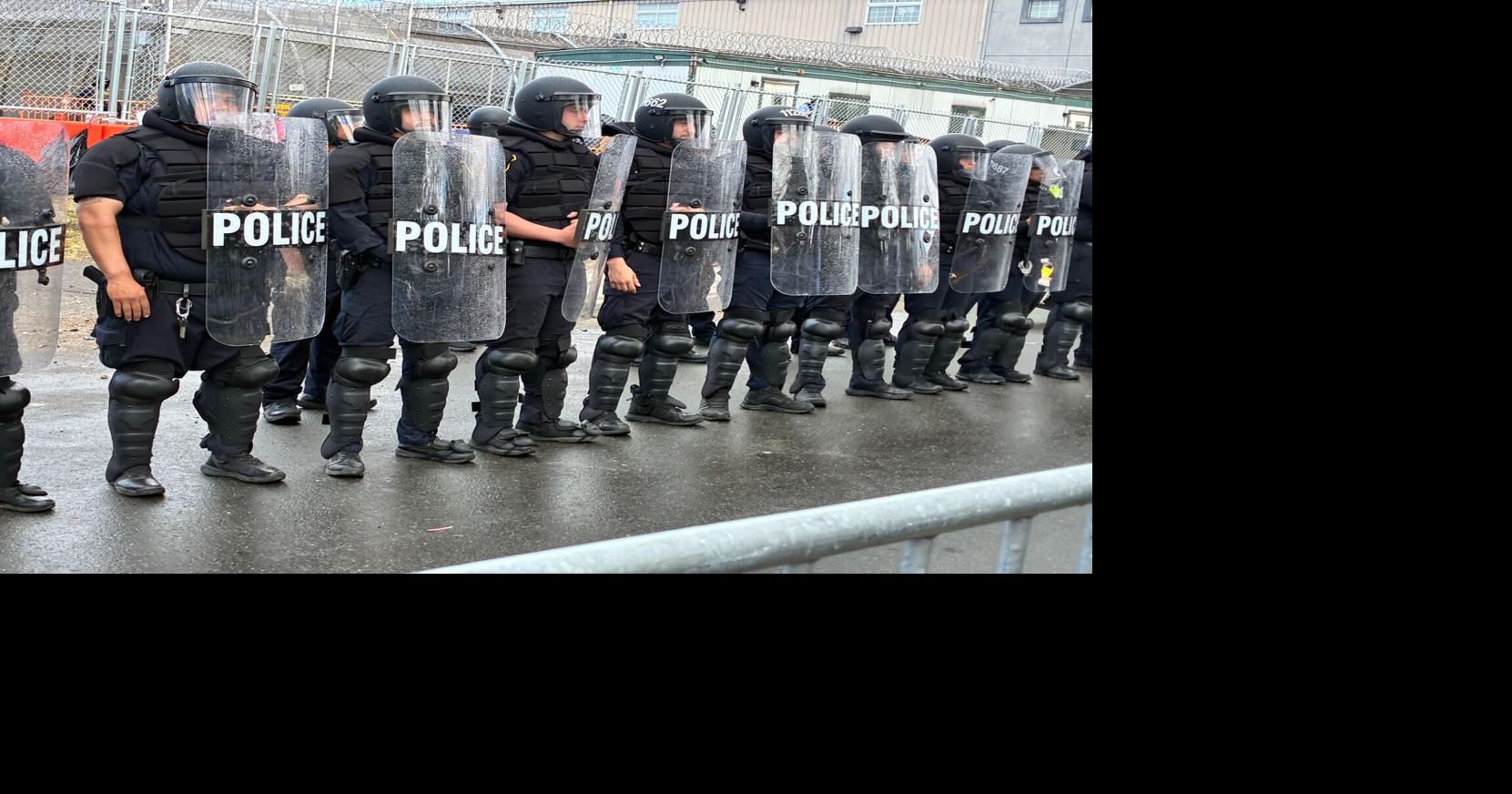 A line of police in riot gear stood outside Delaney Hall detention center in Newark observing pro- and anti-ICE protesters Saturday, May 30, 2026.
