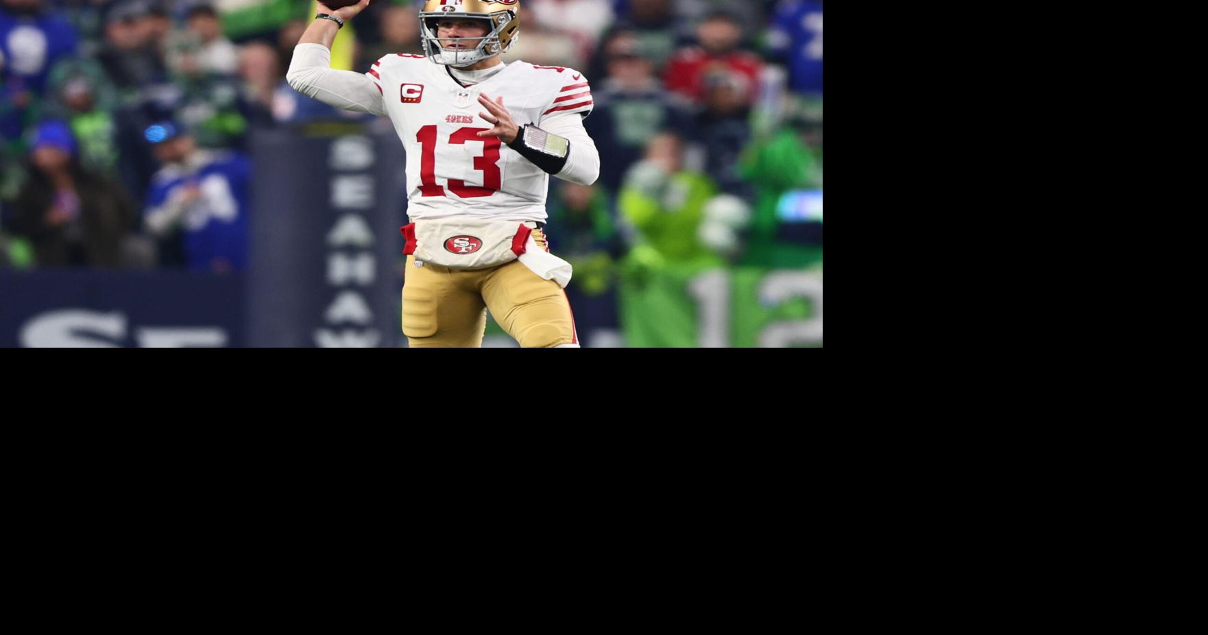 San Francisco 49ers quarterback Brock Purdy (13) throws downfield against the Seattle Seahawks during the first half in an NFC Divisional Round game at Lumen Field in Seattle on Jan. 17, 2026.