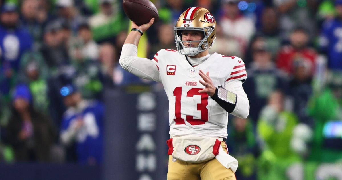 San Francisco 49ers quarterback Brock Purdy (13) throws downfield against the Seattle Seahawks during the first half in an NFC Divisional Round game at Lumen Field in Seattle on Jan. 17, 2026.
