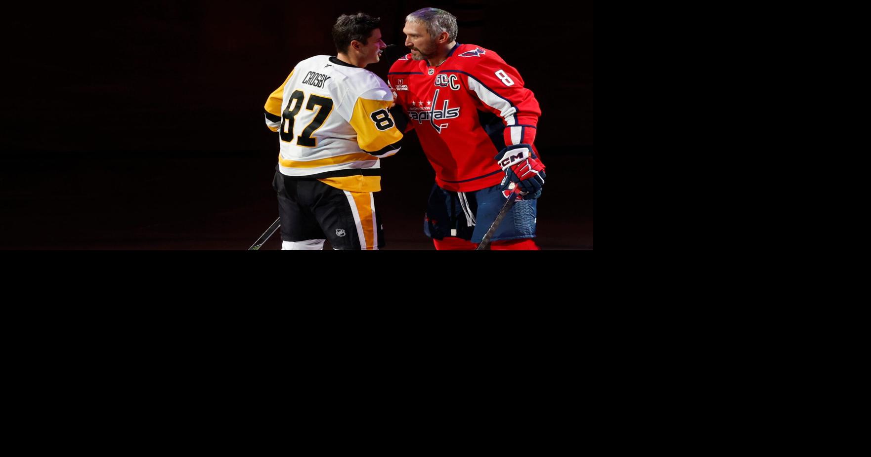 Pittsburgh Penguins center Sidney Crosby (87) and Washington Capitals left wing Alex Ovechkin (8) shake hands after a puck drop ceremony.